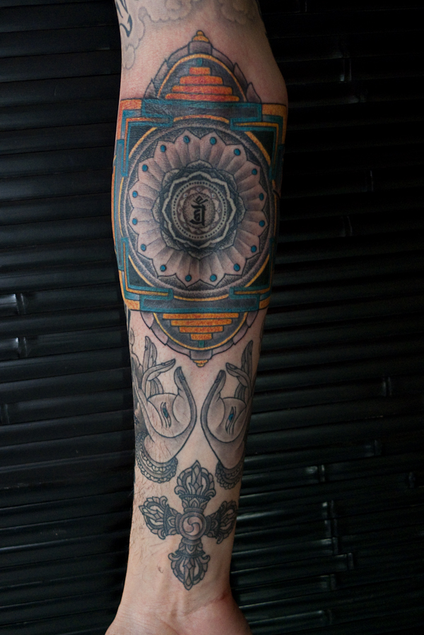 Here is an in progress shot of Micheal's arm a Mandala Based around the top